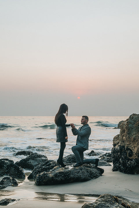 beach proposal with a custom design ring